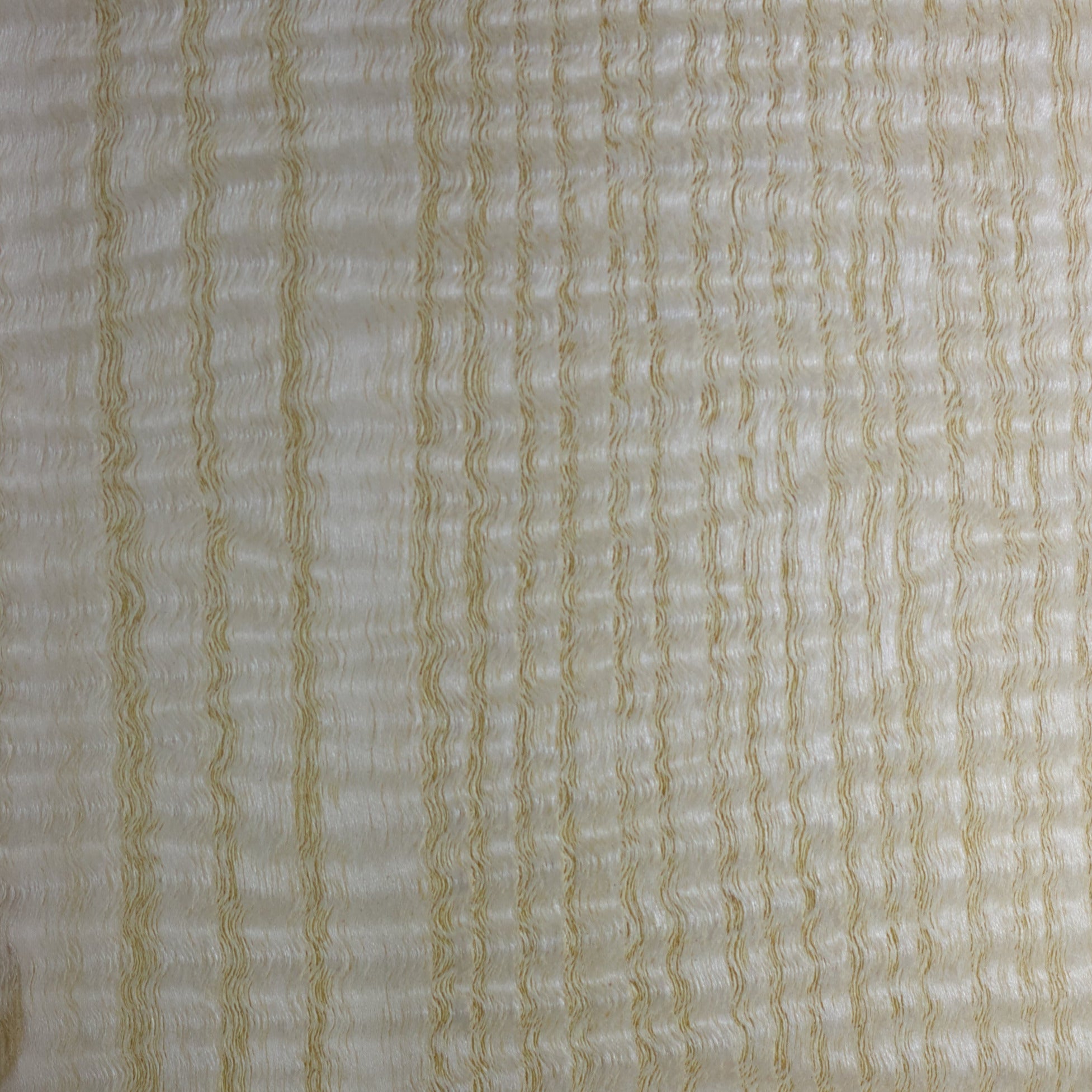 Wooden sample with a label indicating 'Ash Qtr. Cut Figured USA' on a white background.